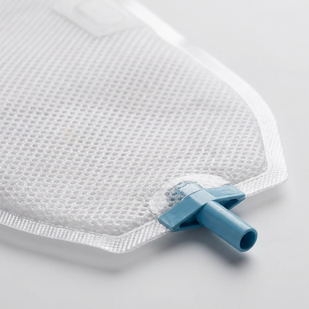 Close-up of the Yowelcom male external catheter mesh surface and blue drainage connector